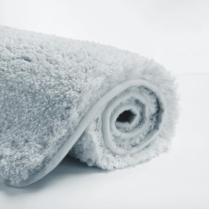 Suchtale Large Soft Bath Mat - Extra Absorbent Shaggy Microfiber Bath Mat (24 x 40, Light Blue) - Machine Washable, Non Slip, Rubber Back