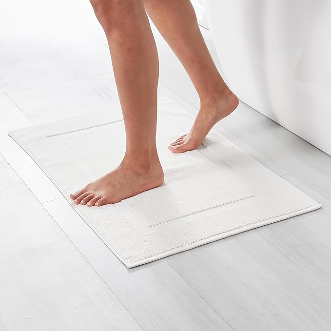 Amazon Basics Non-Slip Cotton Bath Mat, 100% Cotton Absorbent, Machine Washable, 31" L x 20" W, Bright White